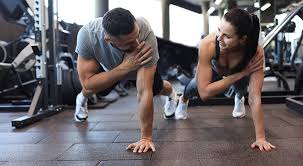 Fitness trainer demonstrating arm toning exercises Ferndown